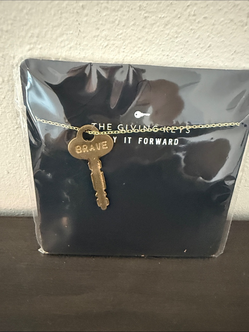 The Giving Keys pay it forward necklace in Brave